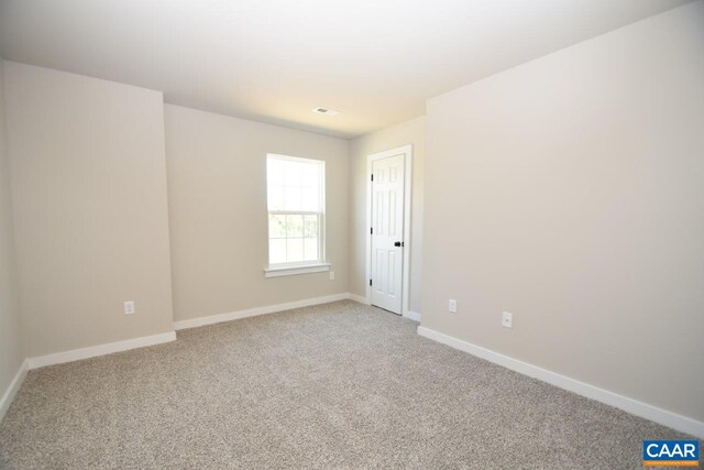 721 Oakmont Dr, Gordonsville, VA 22942 - spare room with light carpet, baseboards, and visible vents