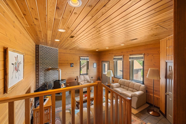 613 Dices Spring Rd, Weyers Cave, VA 24486 - living room with wood ceiling, plenty of natural light, a wood stove, wooden walls, and recessed lighting