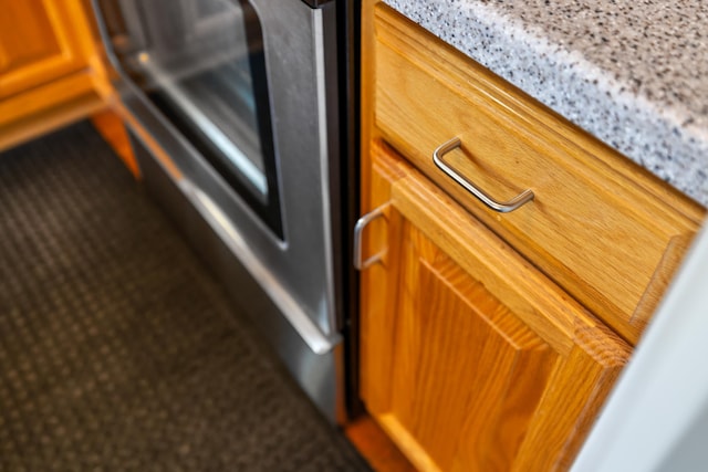 613 Dices Spring Rd, Weyers Cave, VA 24486 - kitchen view of brown cabinets and light stone counters