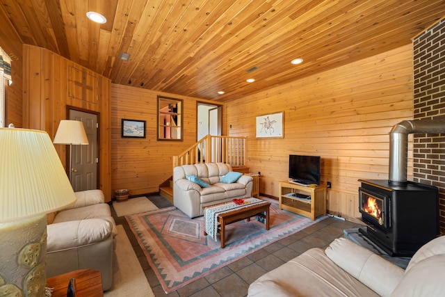 613 Dices Spring Rd, Weyers Cave, VA 24486 - living area featuring a wood stove, wood ceiling, wood walls, recessed lighting, and stairs