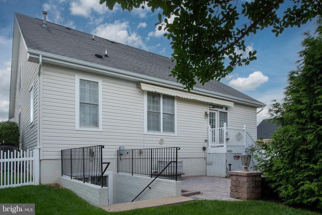 10207 Iverson Ave, Fredericksburg, VA 22407 - back of property with a patio and a shingled roof