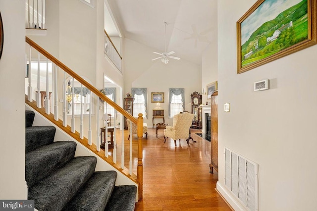 10207 Iverson Ave, Fredericksburg, VA 22407 - entrance foyer featuring high vaulted ceiling, ceiling fan, stairway, wood finished floors, and a fireplace