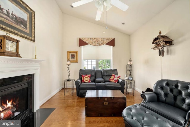 10207 Iverson Ave, Fredericksburg, VA 22407 - living room with ceiling fan, a fireplace with flush hearth, wood finished floors, baseboards, and high vaulted ceiling
