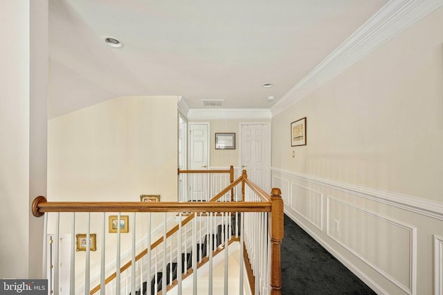 10207 Iverson Ave, Fredericksburg, VA 22407 - hall featuring an upstairs landing, crown molding, wainscoting, a decorative wall, and carpet