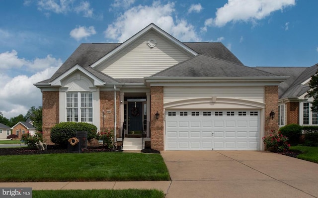 10207 Iverson Ave, Fredericksburg, VA 22407 - single story home with brick siding, concrete driveway, an attached garage, a front yard, and roof with shingles