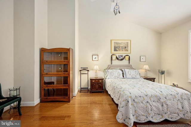 10207 Iverson Ave, Fredericksburg, VA 22407 - bedroom featuring wood finished floors, vaulted ceiling, and baseboards
