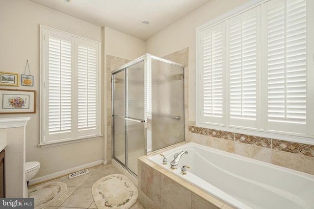 10207 Iverson Ave, Fredericksburg, VA 22407 - full bathroom featuring vanity, a garden tub, a shower stall, toilet, and tile patterned floors