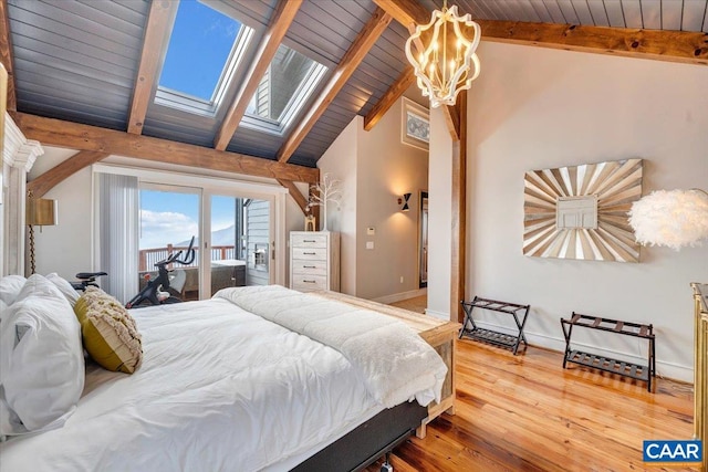 380 Blackrock Cir, Wintergreen Resort, VA 22967 - bedroom with baseboards, lofted ceiling with skylight, wood ceiling, access to outside, and wood finished floors