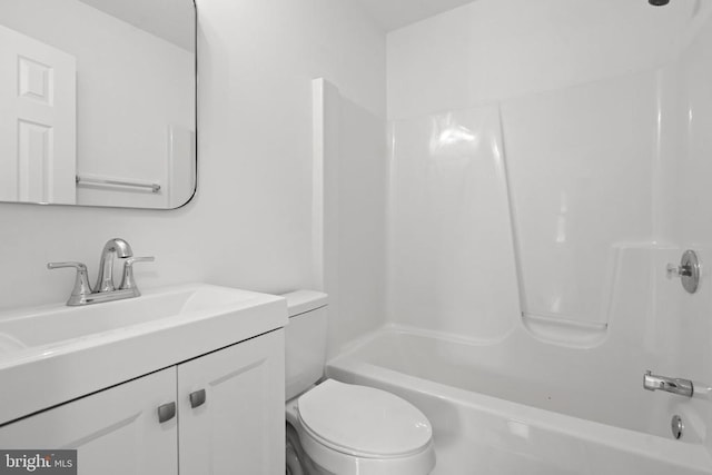bathroom with toilet, vanity, and bathing tub / shower combination