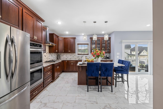 4220 Traveler Rd, Rockingham, VA 22801 - kitchen featuring stainless steel appliances, wall chimney range hood, light marble finish floors, a kitchen bar, and recessed lighting