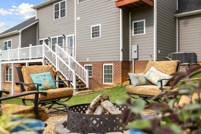 4220 Traveler Rd, Rockingham, VA 22801 - rear view of property with brick siding, stairs, a wooden deck, and central air condition unit