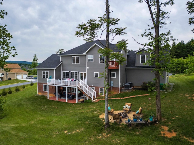 4220 Traveler Rd, Rockingham, VA 22801 - rear view of property with a patio, stairway, a wooden deck, and a yard