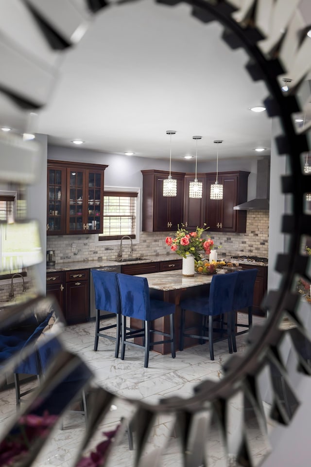 4220 Traveler Rd, Rockingham, VA 22801 - kitchen with wall chimney range hood, a breakfast bar area, decorative backsplash, recessed lighting, and decorative light fixtures
