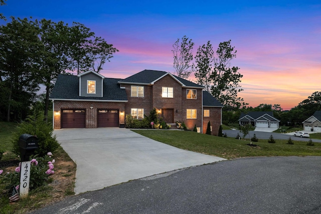 4220 Traveler Rd, Rockingham, VA 22801 - view of front of home with brick siding, concrete driveway, and a front lawn