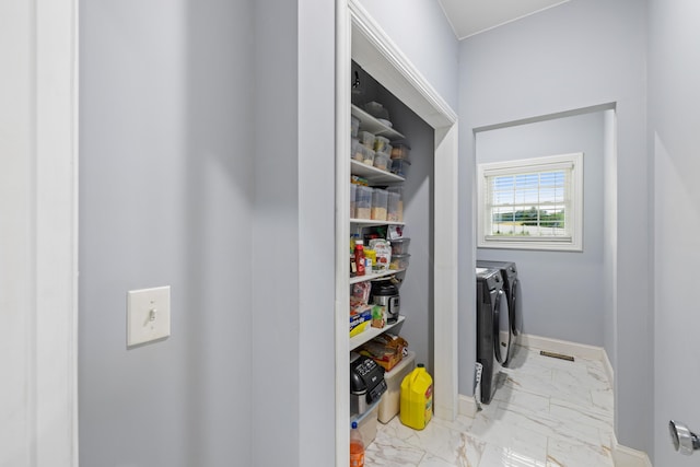 4220 Traveler Rd, Rockingham, VA 22801 - laundry room featuring independent washer and dryer, marble look tiles, and baseboards