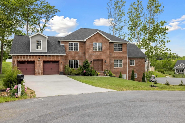 4220 Traveler Rd, Rockingham, VA 22801 - view of front facade featuring brick siding, concrete driveway, a front lawn, roof with shingles, and an attached garage