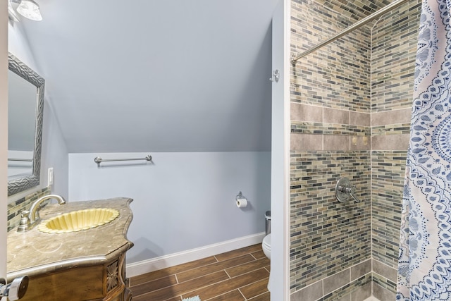 4220 Traveler Rd, Rockingham, VA 22801 - full bathroom featuring toilet, tiled shower, vanity, wood finish floors, and baseboards