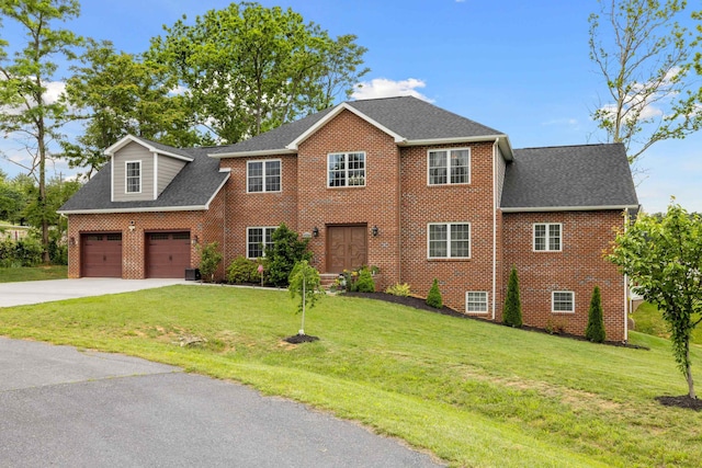 4220 Traveler Rd, Rockingham, VA 22801 - colonial inspired home featuring brick siding, driveway, a front lawn, a garage, and roof with shingles
