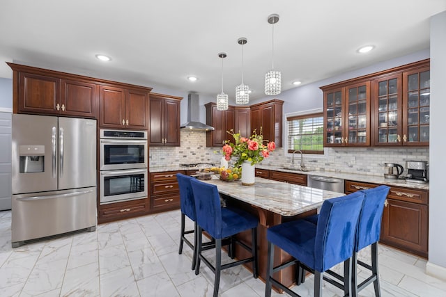 4220 Traveler Rd, Rockingham, VA 22801 - kitchen with appliances with stainless steel finishes, wall chimney exhaust hood, a sink, light marble finish flooring, and a breakfast bar
