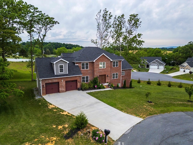 4220 Traveler Rd, Rockingham, VA 22801 - view of front of home with brick siding, concrete driveway, a front yard, and an attached garage