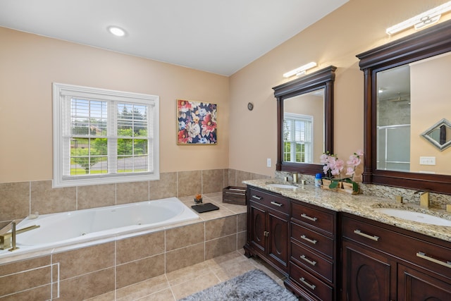 4220 Traveler Rd, Rockingham, VA 22801 - bathroom featuring double vanity, a tub with jets, plenty of natural light, and an enclosed shower