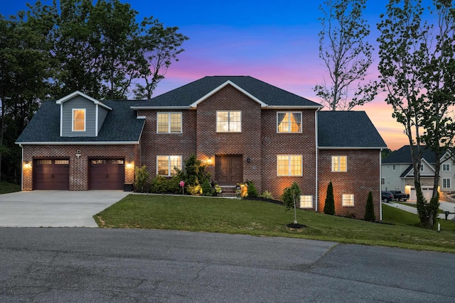 4220 Traveler Rd, Rockingham, VA 22801 - colonial home with driveway, brick siding, a front yard, an attached garage, and a shingled roof
