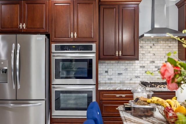 4220 Traveler Rd, Rockingham, VA 22801 - kitchen with appliances with stainless steel finishes, wall chimney range hood, backsplash, and light stone counters
