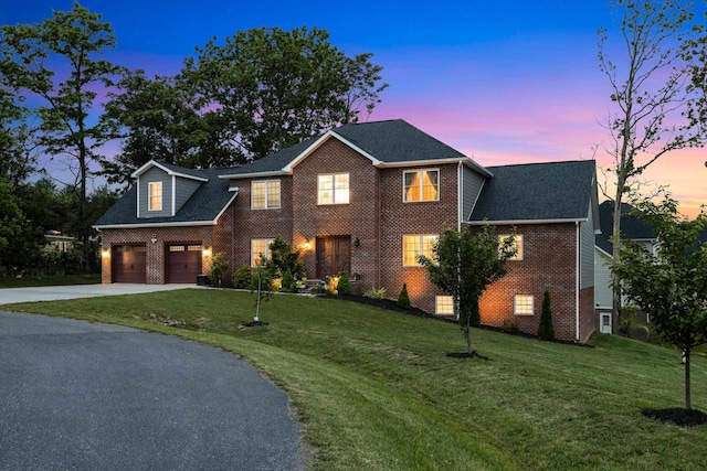 4220 Traveler Rd, Rockingham, VA 22801 - view of front of house featuring driveway, brick siding, and a lawn