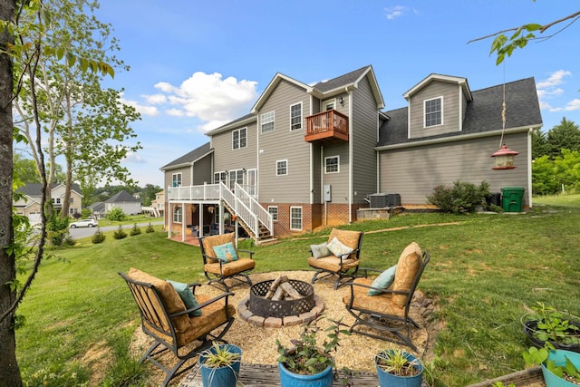 4220 Traveler Rd, Rockingham, VA 22801 - back of property with an outdoor fire pit, stairway, a balcony, and a yard