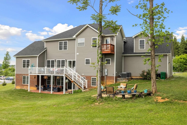4220 Traveler Rd, Rockingham, VA 22801 - back of property featuring a patio area, a yard, and roof with shingles