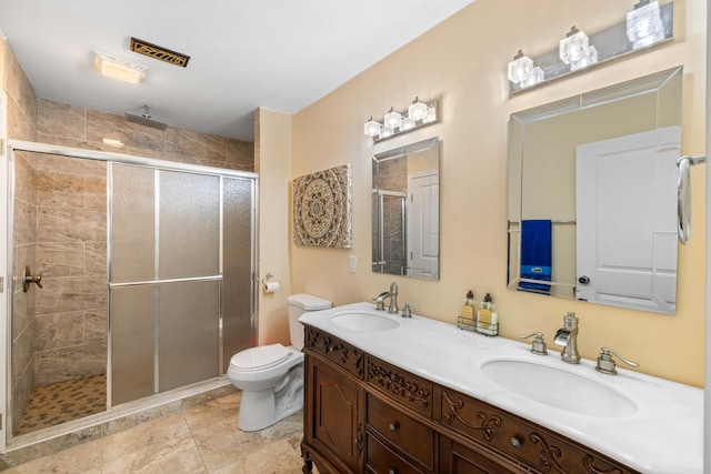 4220 Traveler Rd, Rockingham, VA 22801 - full bathroom featuring a stall shower, toilet, and double vanity