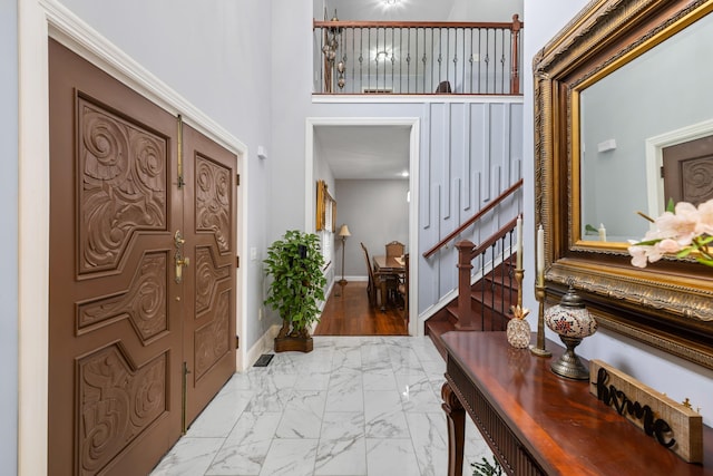 4220 Traveler Rd, Rockingham, VA 22801 - entrance foyer with marble finish floors, stairway, baseboards, and a high ceiling