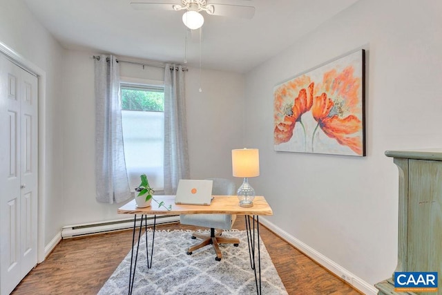 office space with a baseboard radiator, baseboards, ceiling fan, and wood finished floors