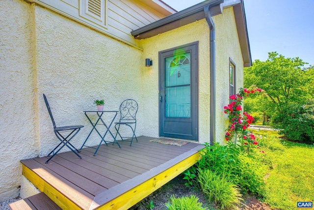207 Douglas Ave, Charlottesville, VA 22902 - doorway to property with stucco siding and a wooden deck