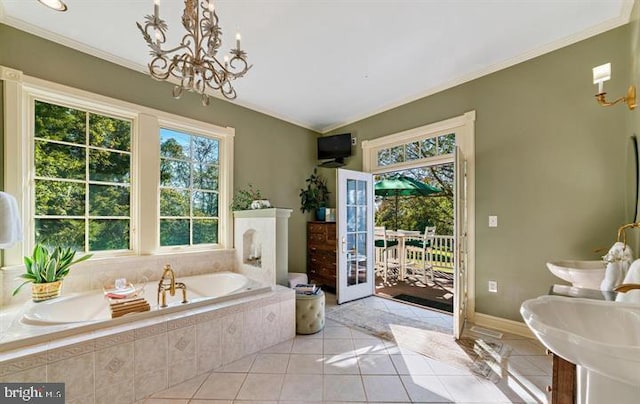  - bathroom featuring tile patterned floors, a bath, ornamental molding, and a chandelier