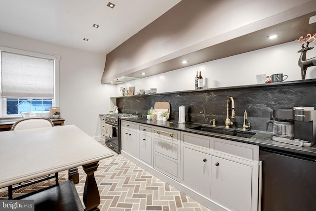  - kitchen with high end range, refrigerator, backsplash, dark countertops, and brick patterned floors