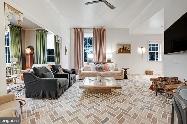  - living area with ceiling fan, ornamental molding, and brick floors