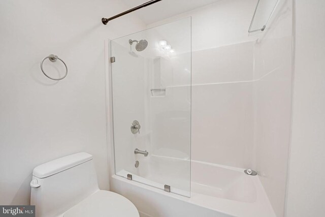  - bathroom featuring toilet and shower / tub combination