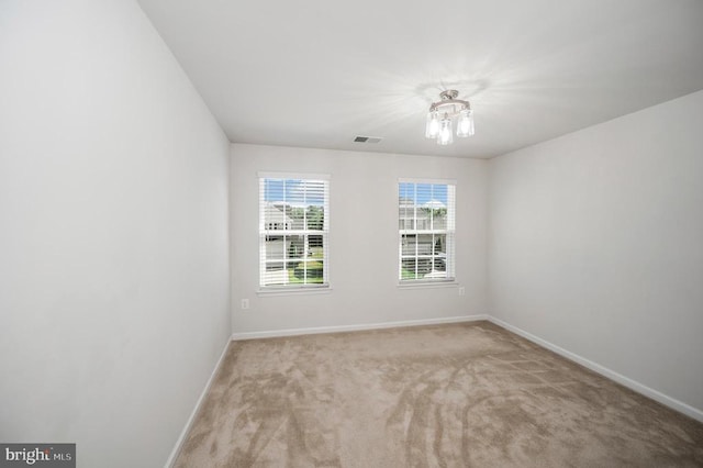 5809 Spruce Valley Dr, Fredericksburg, VA 22407 - carpeted empty room featuring baseboards and a chandelier