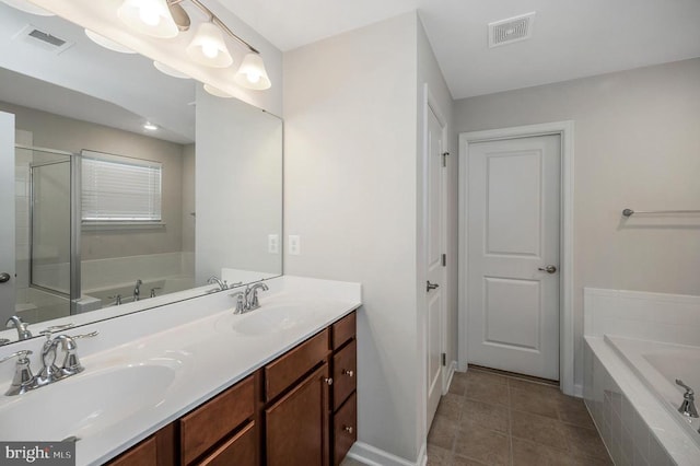 5809 Spruce Valley Dr, Fredericksburg, VA 22407 - full bath with a garden tub, double vanity, tile patterned flooring, and a stall shower