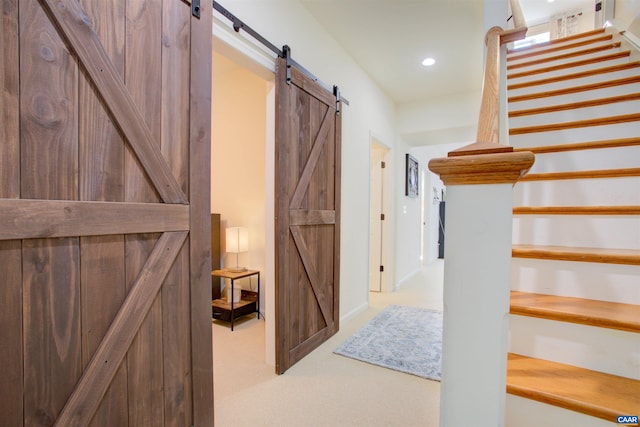 1623 Brandywine Dr, Charlottesville, VA 22901 - hall featuring a barn door, carpet floors, stairway, and recessed lighting
