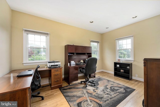 office with light wood-style floors, baseboards, and recessed lighting