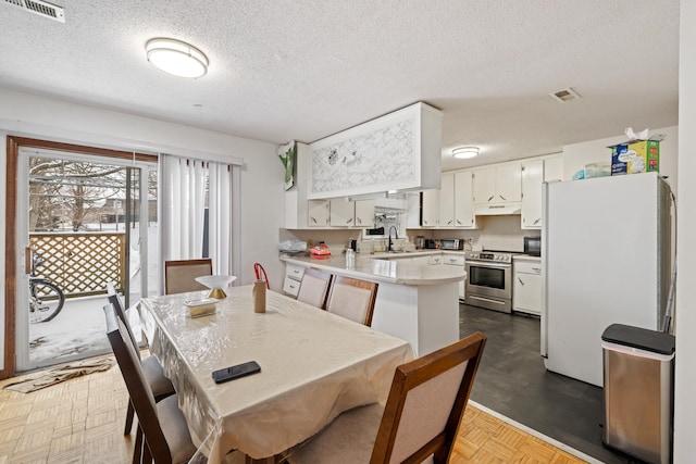 728 Foley Rd, Harrisonburg, VA 22801 - dining room with visible vents and a textured ceiling