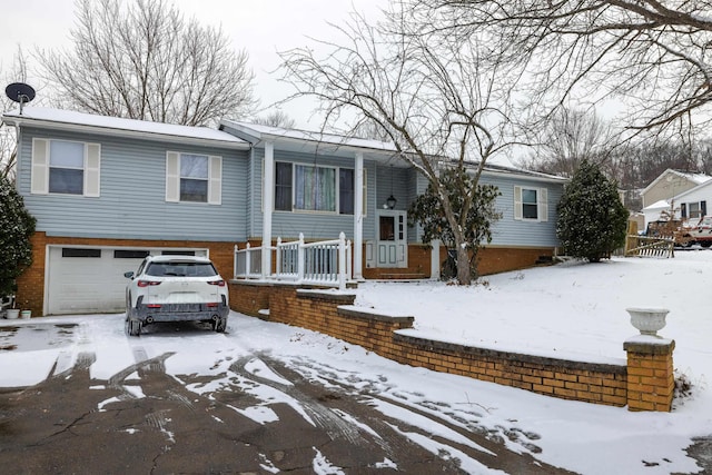 728 Foley Rd, Harrisonburg, VA 22801 - raised ranch with a porch, brick siding, and a garage