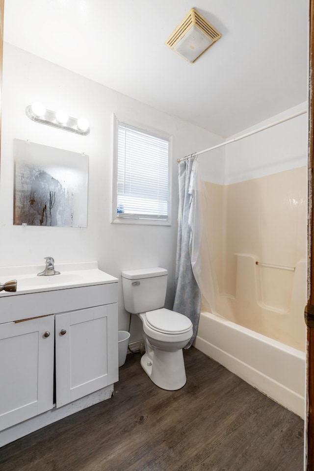 728 Foley Rd, Harrisonburg, VA 22801 - bathroom with toilet, wood finished floors, shower / tub combo, visible vents, and vanity