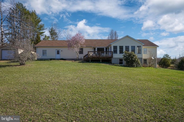  - back of property featuring a deck and a yard