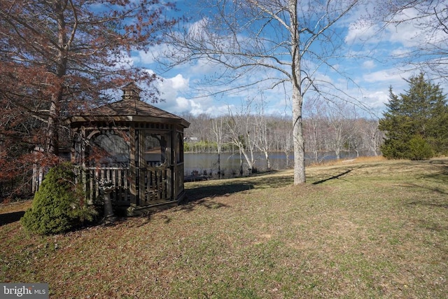  - view of grassy yard featuring a water view and a gazebo