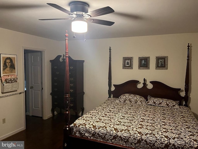  - bedroom with wood finished floors, ceiling fan, and baseboards