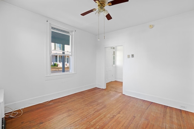 111 S High St, Edinburg, VA 22824 - unfurnished room with baseboards, light wood finished floors, and a ceiling fan