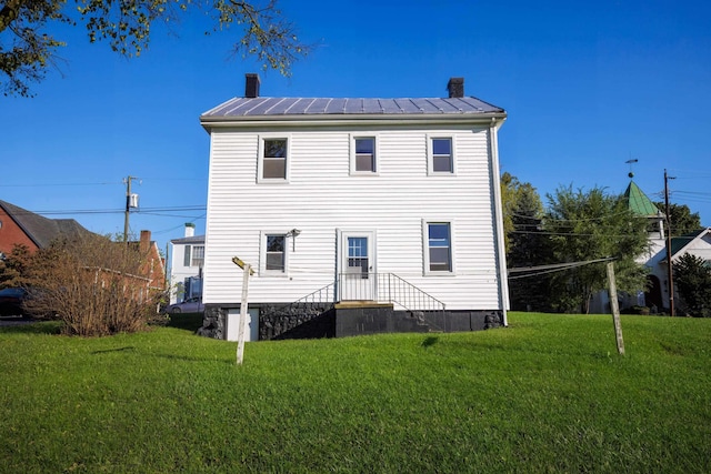 111 S High St, Edinburg, VA 22824 - back of property with a yard, a chimney, metal roof, and a standing seam roof
